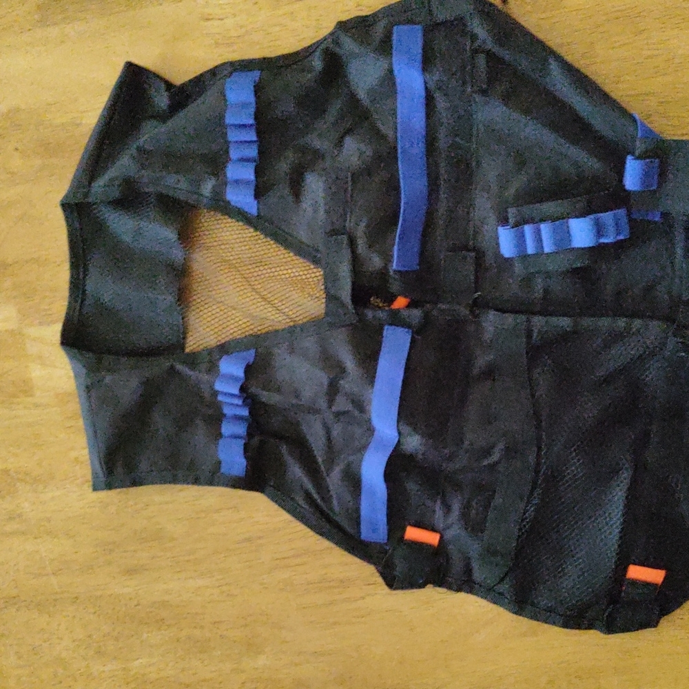 Nerf vest with a nerf bracelet for darts